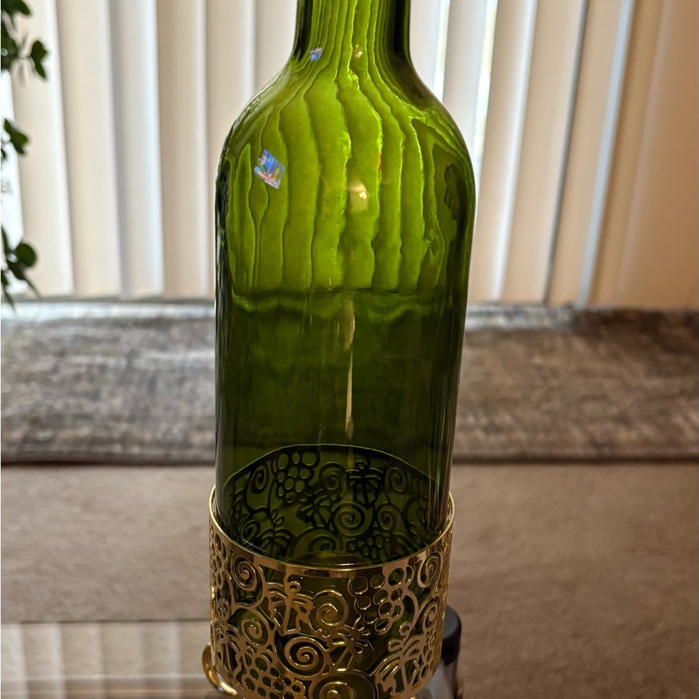 Green Glass Bottle with Gold Decorative Base
